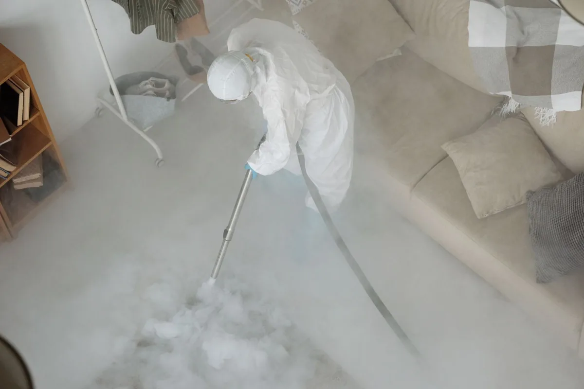 Biohazard cleanup technician in protective equipment, Eastridge, Wichita, KS
